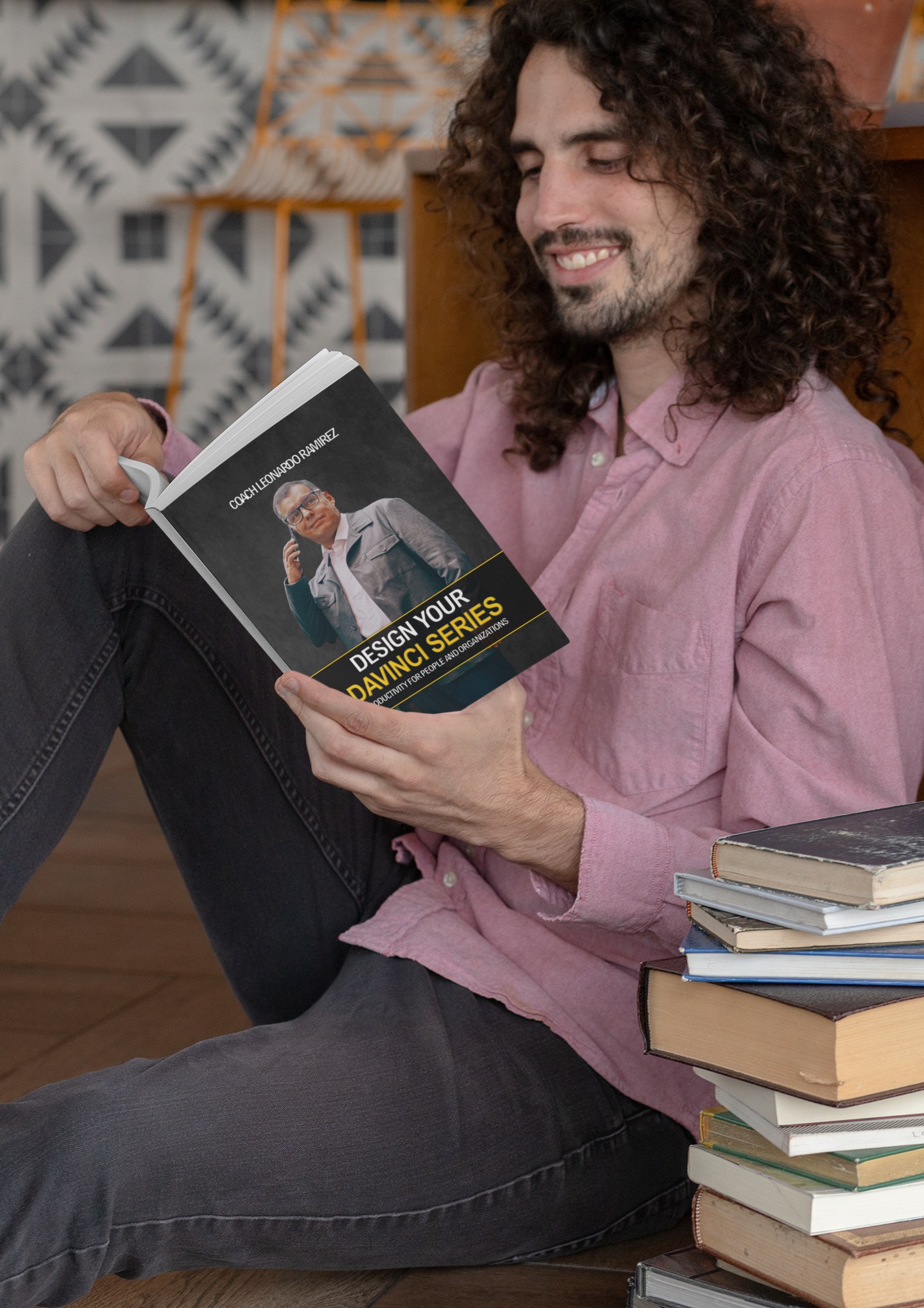 Happy reader enjoying Design Your Da Vinci book